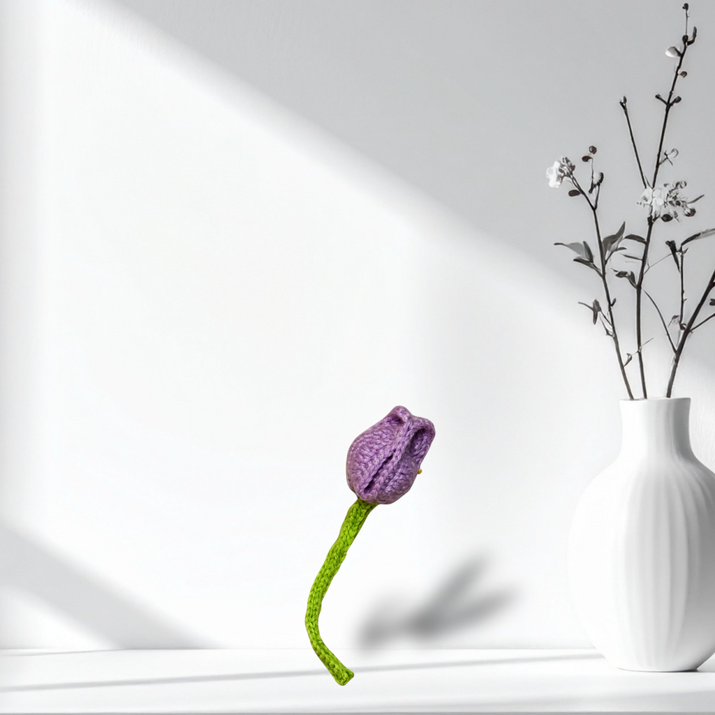 Roselle the Tulip Chunkle & Puff cat toy styled on shelf with ceramic vase, purple woven flower design, designer cat toy for batting and carrying, botanical infused independent play cat toy