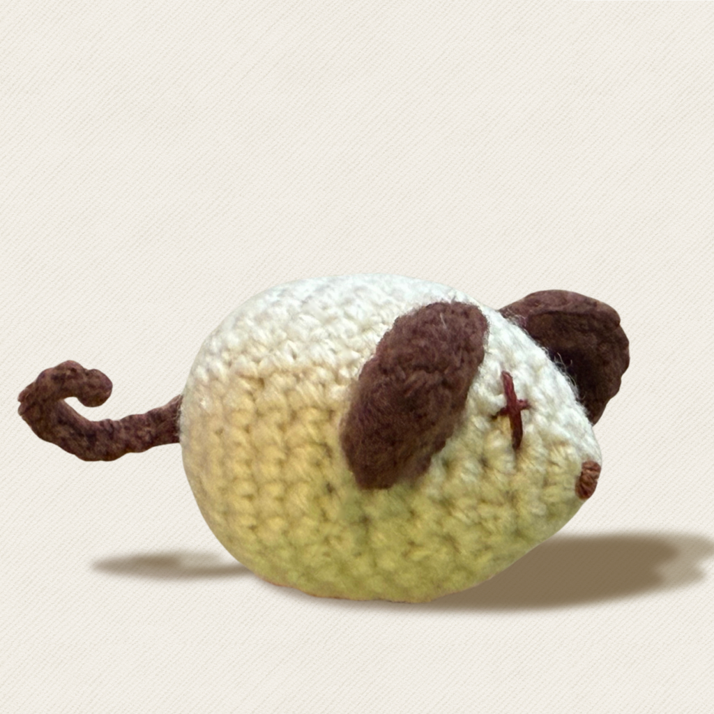 Mouse shaped woven cat toy side profile showing curly tail and brown ear detail, Miracle Nip botanical catnip alternative by Chunkle and Puff