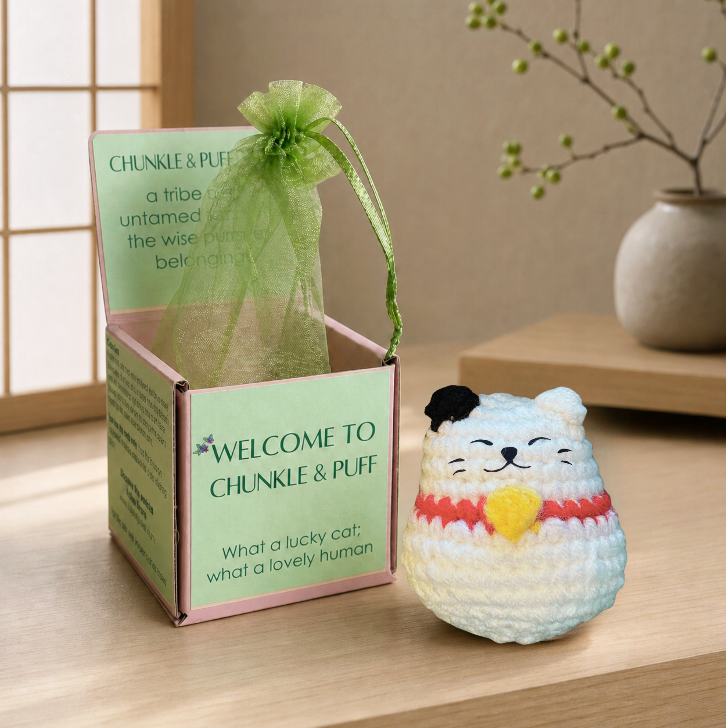 Lucky Cat shaped cat toy. Chunkle Puff indoor cat toy with Miracle Nip displayed beside Feline Grove welcome box packaging