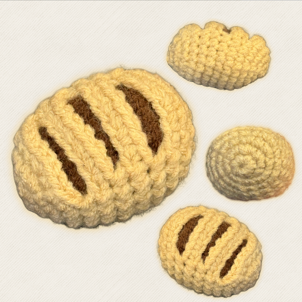 Chocolate croissant shaped cat toy multiple angles showing chocolate stripe detail, silvervine and valerian botanical catnip alternative by Chunkle and Puff