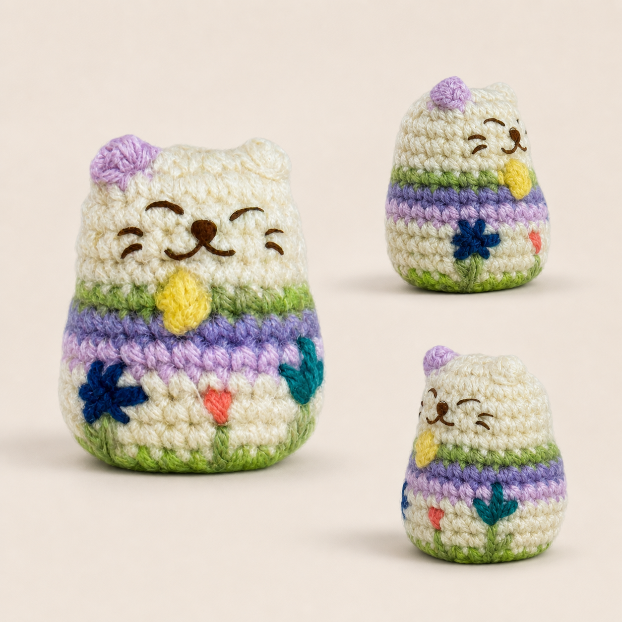 Multi angle view of woven lucky cat toy showing rounded form, pastel stripes, and embroidered facial details, soft textured surface for grip and play, artisan Chunkle & Puff cat toy infused with Miracle Nip botanical cat blend