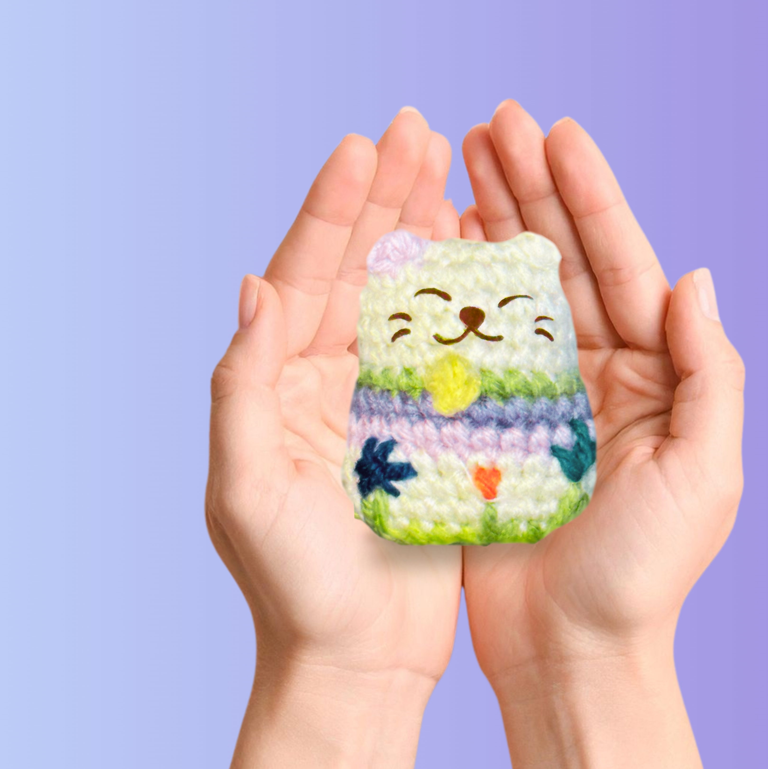 Small woven lucky cat toy cradled in hands, compact palm-sized form with soft textured stitches and pastel floral detailing, designed for batting and carrying, artisan Chunkle & Puff cat toy infused with Miracle Nip botanical catnip alternative blend